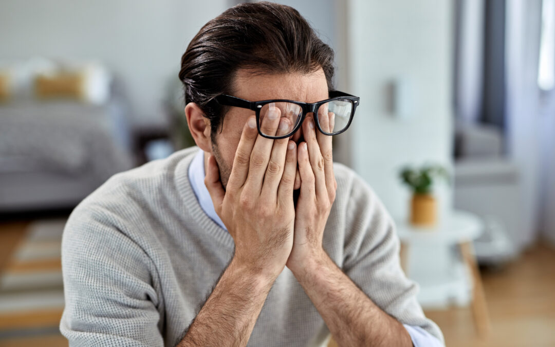 Man experiencing stress in Ottawa, reflecting anxiety about work and government job security.