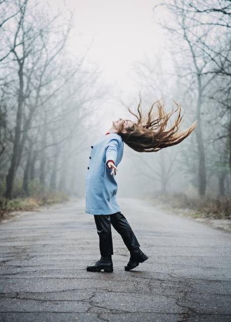 Mindfulness-based cognitive therapy, Mindfulness practices. Young woman with long hair relaxing in the forest.