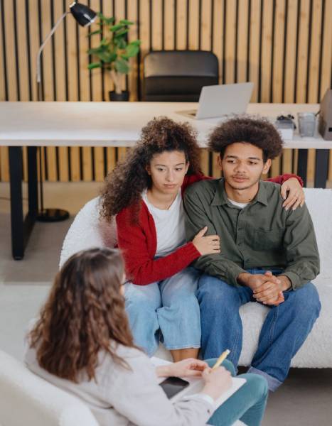 A couple of men and women are seeing a psychologist, taking care of their mental health in their relationship. joint therapy for solving communication problems in the family. 