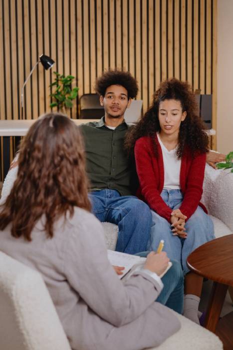 couple of man and woman at psychologist, taking care of mental health in relationship. joint therapy for solving communication problems in family. moral support for young African Americans married